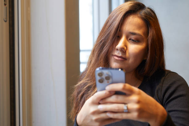 istock Young lady online banking 1438117892