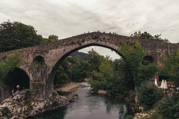 istock Old touristic Roman bridge over Sella River in Cangas de Onis, Spain 1438118177