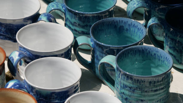 istock Closeup of handmade ceramic cups for sale 1438118919