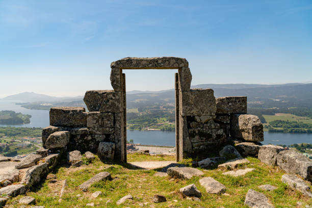 istock Ancient building ruinswith an open door with a landscape in the background 1438119657