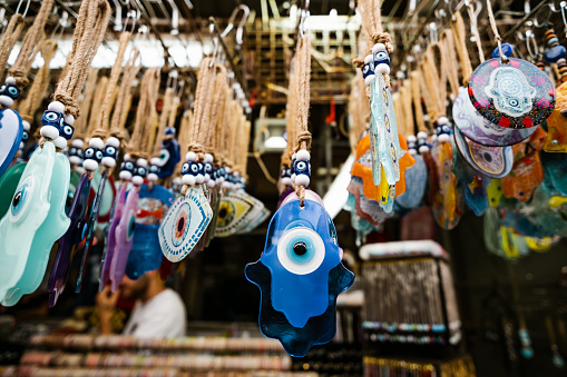 Hamsa souvenirs in Jaffa Flee Market  in Tel Aviv, Israel. Old traditional part of the city, Jaffa Flee Market is a vibrant area of the old city of Jaffa, filled out with various businesses, restaurants and street vendors.