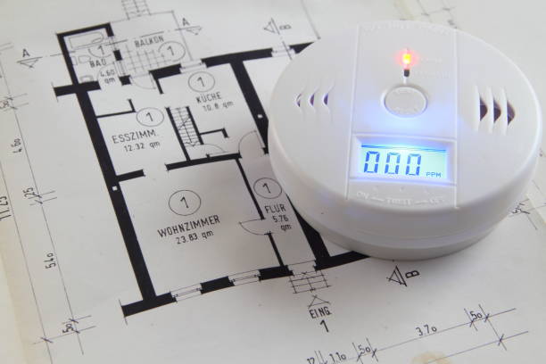 co-detector with tools on a blueprint stock photo