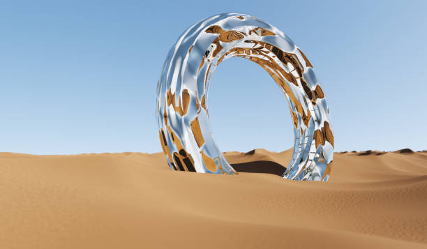 Desert landscape with shiny ring in sand on sunny day.