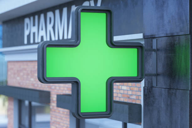 green cross pharmacy sign - green cross imagens e fotografias de stock