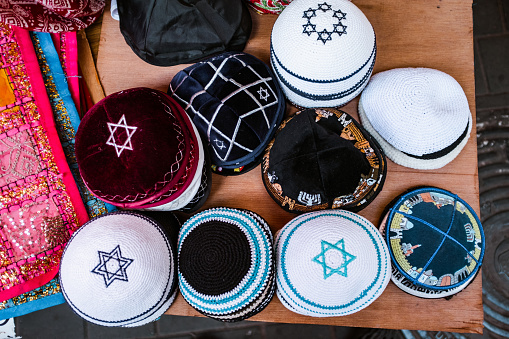 Yarmulke souvenirs in Jaffa Flee Market  in Tel Aviv, Israel. Old traditional part of the city, Jaffa Flee Market is a vibrant area of the old city of Jaffa, filled out with various businesses, restaurants and street vendors.