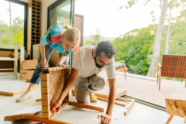 istock Assembling furniture for our new home 1438122125
