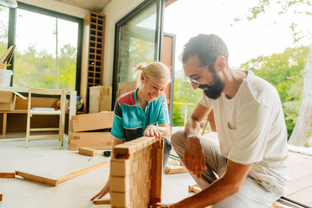 istock Assembling furniture for our new home 1438122147