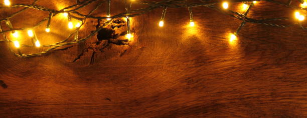 istock wooden board with fairy lights 1438122247