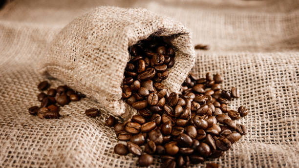 istock High angle shot of coffee beans on a sack bag 1438122338