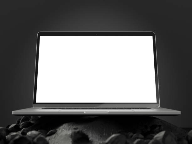 Laptop with Blank White Screen on Abstract Black Rock Surface