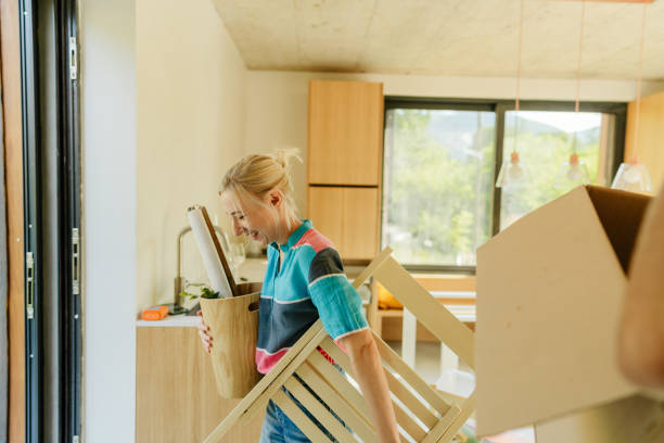 istock Young woman moving into a new home 1438123744