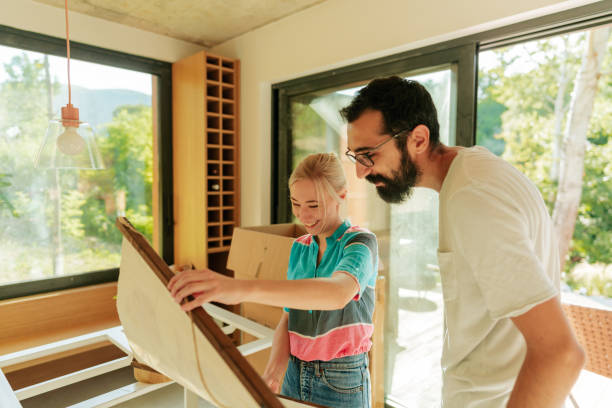 istock Young couple moving into a new home 1438123888
