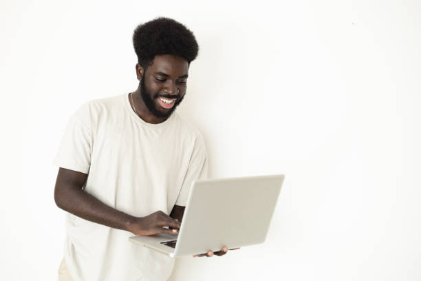 istock Studio portrait of a young African American student using laptop 1438123987