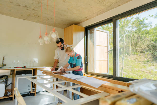 istock Checking architectural project of our new home 1438124404