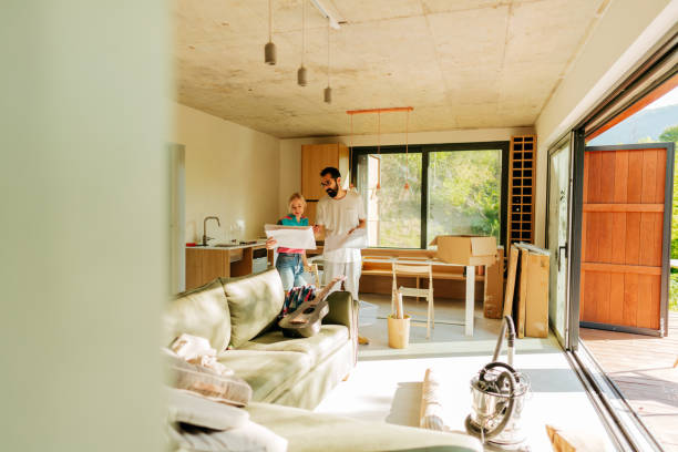 istock Checking architectural project of our new home 1438124447