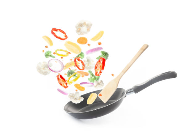 istock Flying vegetables over a frying pan 1438125151