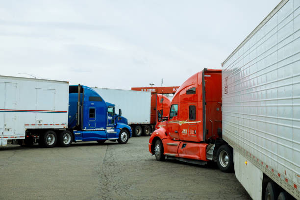 Resting place the truck stop on various types of trucks in a parking lot off the highway with gas station for refueling car on the USA 21 OCTOBER 2022 Yuma AZ US Resting place truck stop various types of trucks in parking lot highway with gas station for refueling car car hauling stock pictures, royalty-free photos & images