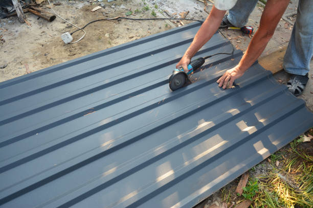 istock Roofer cutting lightweight metal roof sheet with grinding machine. Roofing construction. 1438126023