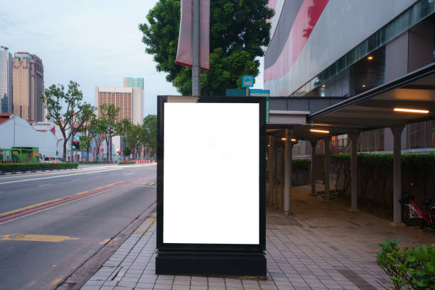 White wrinkled poster template in city. Glued paper mockup. Blank wheatpaste on textured wall. Empty street art sticker mock up. Clear urban glued advertising canvas. Billboard advertisment advertiser. stock photo