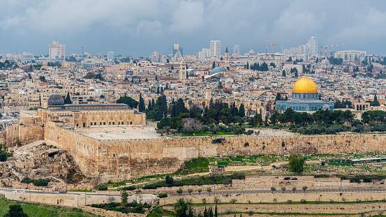 The Wailing Wall, Jerusalem, Israel - November 11, 2021: Jewish orthodox believer reading the Torah and praying facing the Western Wall, also known as Wailing Wall in the old city in Jerusalem, Israel.