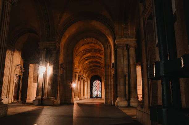 Beautiful landscape shot of the Louvre museum in Paris Paris, France – November 02, 2020: Beautiful landscape shot of the Louvre museum in Paris during the night. musee du louvre stock pictures, royalty-free photos & images