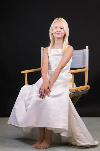 Formal portrait of a ten-year-old girl wearing her special dress.