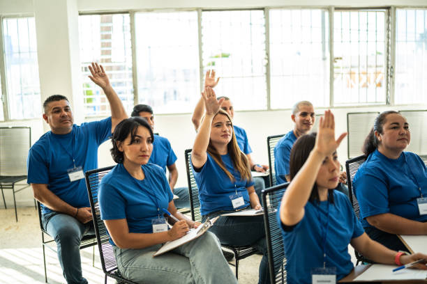 istock Volunteers with arms raised on a community center 1438130615