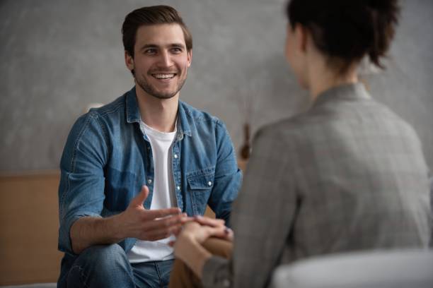 istock Psychologist talking with patient on therapy session. 1438131142