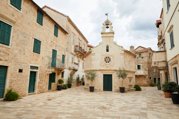 Church on a small square in Jelsa on the island of Hvar Church on a small square in Jelsa on the island of Hvar jelsa stock pictures, royalty-free photos & images