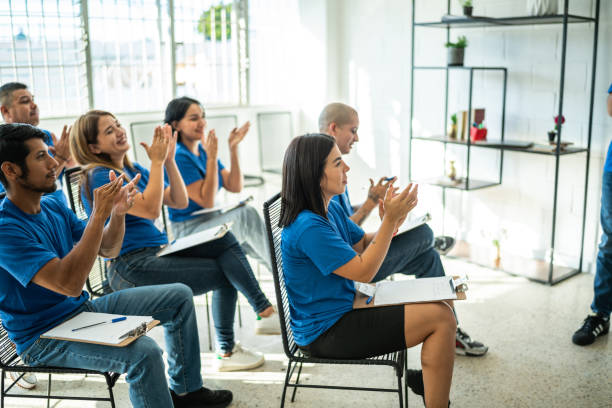 istock People clapping during volunteer presentation at community center 1438132701