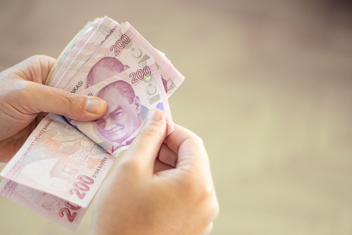 Close-Up Man Hand And Counting Turkish Lira. Finance And Economy.