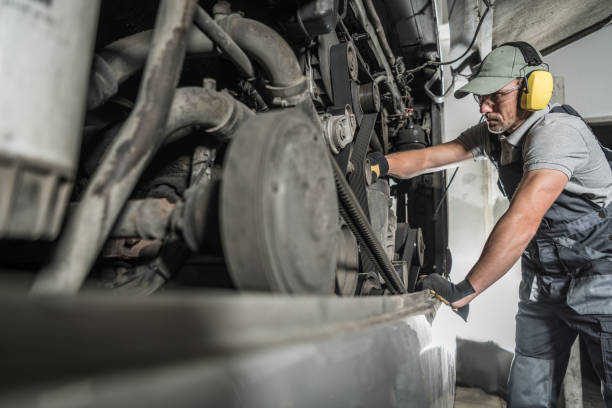 istock Mechanic Doing a Health Check of the Coach Engine 1438139841