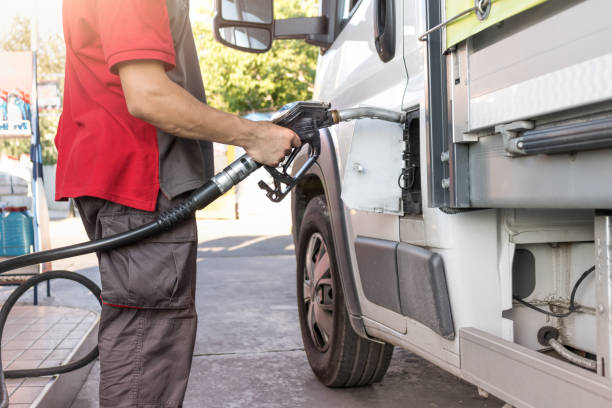 istock Truck refueling on a petrol station 1438142812