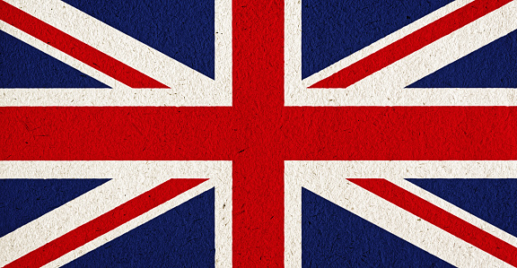 Flag of the UK, the Union Jack, on richly textured paper.
