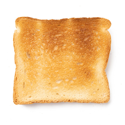 roasted toasts bread isolated on white background. Pieces of lightly toasted white bread. Close-up of toast. Top view.