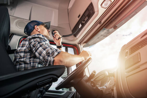 istock Trucker Having a Conversation via CB Radio on the Route 1438144561