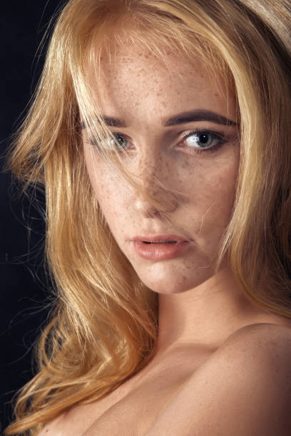 istock woman with freckles 1438145308