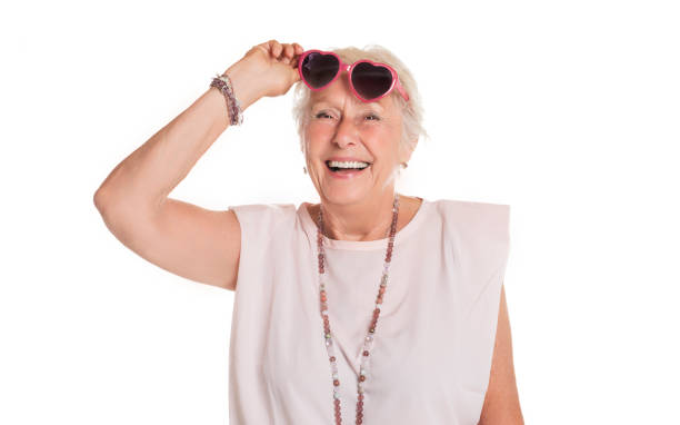 istock smiling retired senior woman looking at camera isolated on white background 1438145552