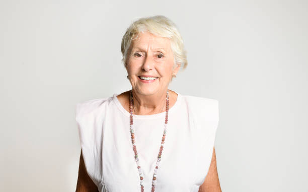 istock smiling retired senior woman looking at camera isolated on white background 1438145645