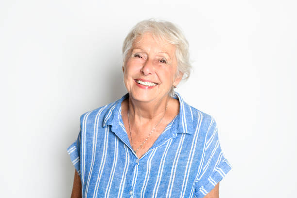 istock smiling retired senior woman looking at camera isolated on white background 1438145794