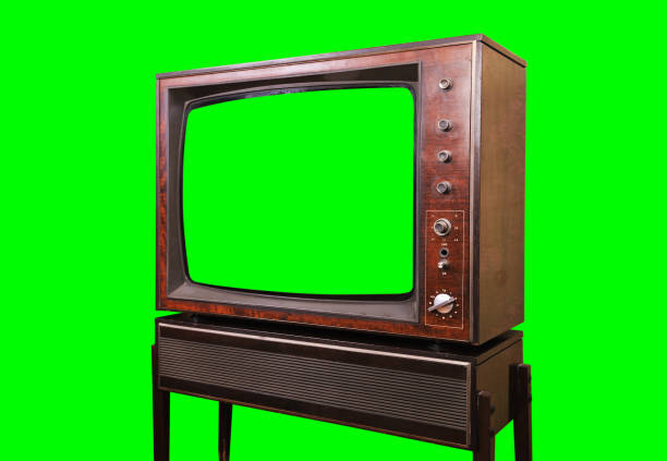 istock Old vintage TV with green screen isolated on green background. Side view. 1438149298