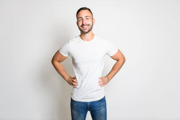 istock portrait of handsome young man. Cheerful men isolated on gray background studio shot 1438149727