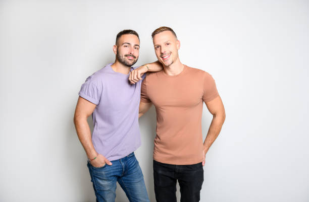 The Two young men couple over white background on studio