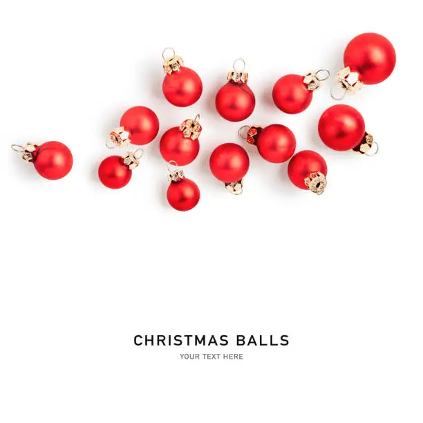 Christmas baubles, red balls creative layout isolated on white background. Design element. Holiday decoration. Flat lay, top view