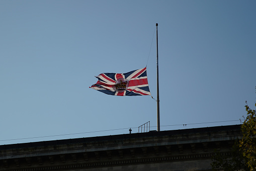 Istanbul, Turkiye - September 11, 2022: Flag fly at half mast on British Consulate General Istanbul honoring the death of Queen Elizabeth II