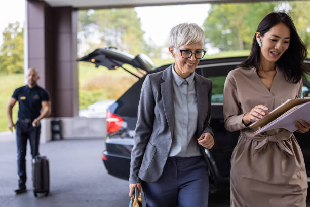 istock Businesswoman entering a hotel with her assistant 1438152790