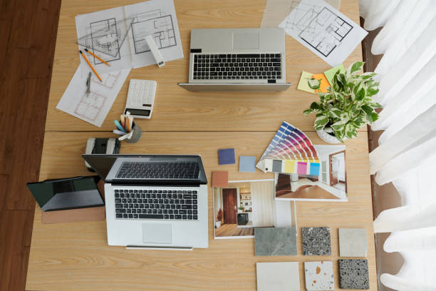 istock Documents with House Plan on Desk of Interior Designer 1438152843