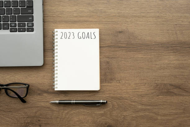 istock Notebook with 2023 goals text on it to apply new year resolutions and plan. 1438152882