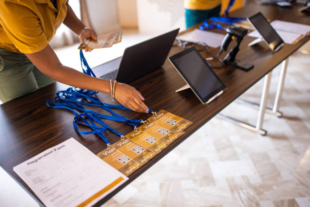 unrecognizable woman arranging business id cards before a business conference - event convention center business hotel imagens e fotografias de stock