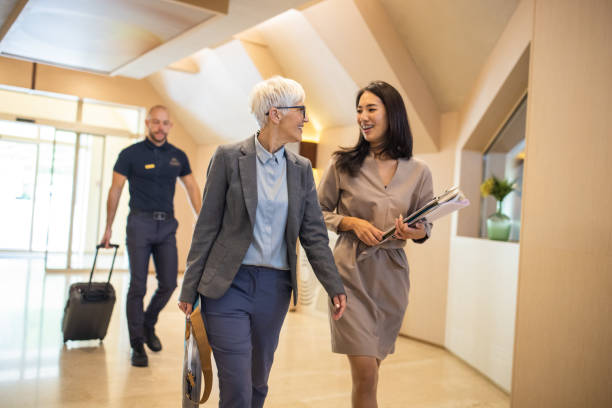 istock Businesswoman entering a hotel with her assistant 1438153018
